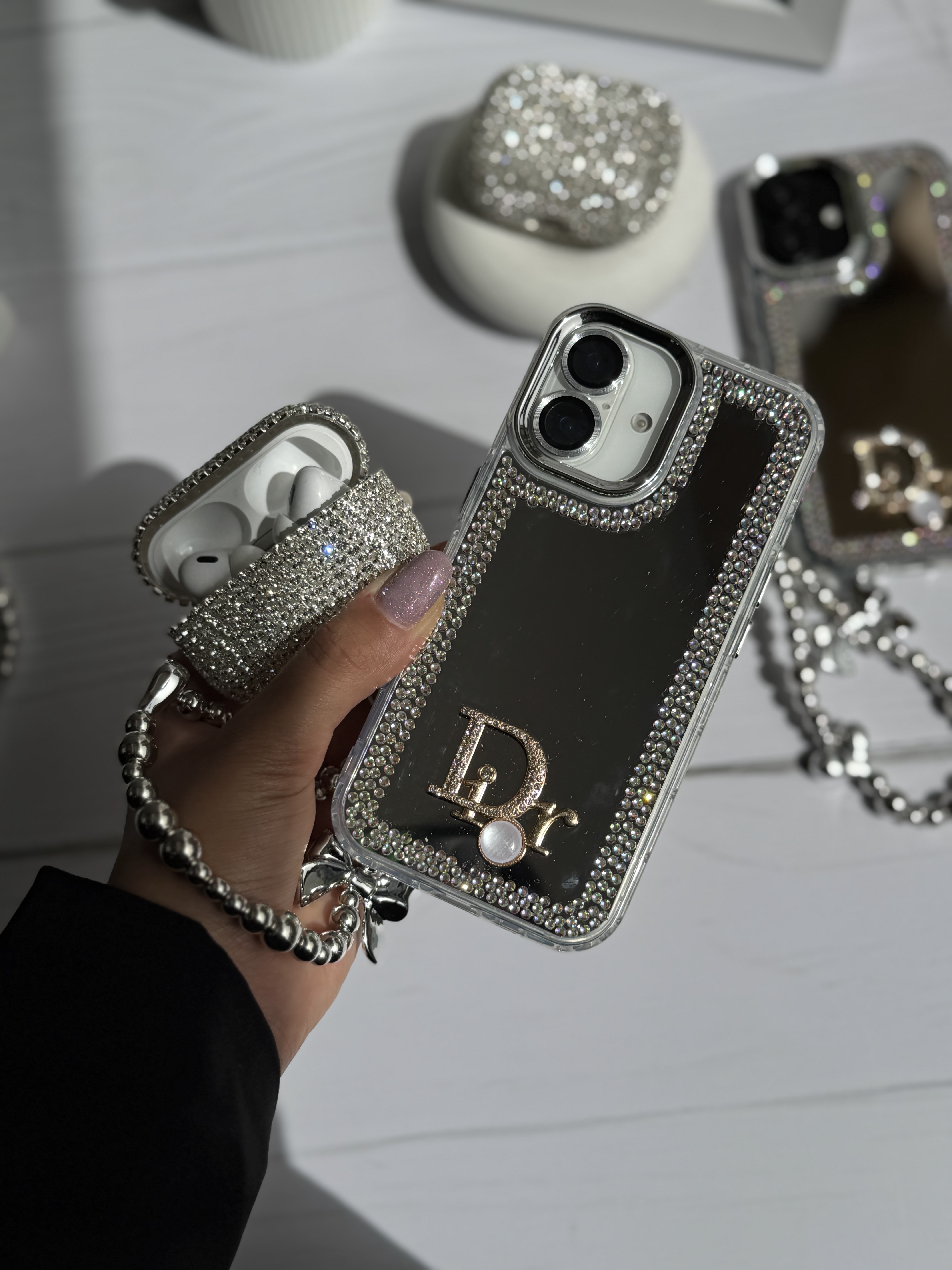 قاب گوشی آیفون Dior آینه ای دور نگین با آویز قلبی پاپیونی